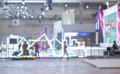 Blurry workers preparing exhibition event hall. Bokeh background of trade show business, world or...