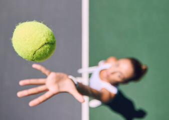 Tennis ball, sports and female player throwing and serving on a court outside from above. Athletic...