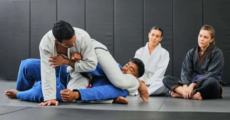 Fotobehang Fight, karate class and martial arts teamwork in competition, challenge or self defense sport in wellness school. Fitness sports coach teaching students gym workout, floor exercise or health training © Delcio Fernandes/peopleimages.com