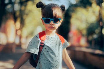 Cool Girl ready to Attend the Kindergarten. Child wearing a backpack ready for the first day of...