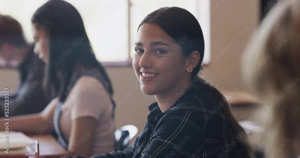 Poster student, education and learning with a young girl sitting at her desk in a classroom during class at