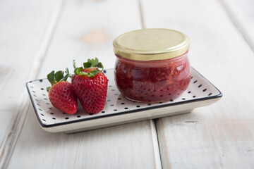 Strawberry Little glass jar of fresh fruit marmalade jam jelly