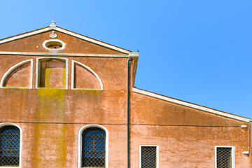Traditional vintage windows with old house in historic Burano island, Venice, Italy.