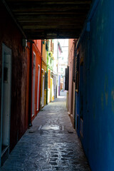 An alley street in Burano, Venice, Italy
