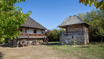 Fototapeta na wymiar Old wooden house – traditional romanian style – at village museum Curtisoara, Gorj, Romania