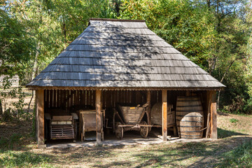 Old wooden house – traditional romanian style – at village museum Curtisoara, Gorj, Romania