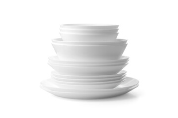 Plates and bowls stacked on a white .background .