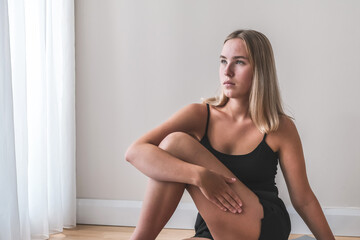 Fototapeta premium Sports fit home.Girl goes sports, fitness, yoga, meditative breathing practices.Meditation, relaxation,mental health. Active lifestyle, personal care, health.Wellness,workout,physical health.Smart fit