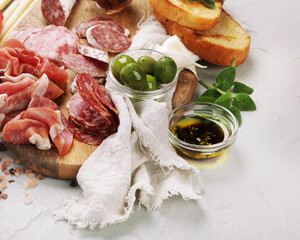 Sausages assortment on light background.