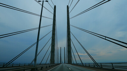 Naklejka premium Looking up at the pylons of the massive Øresund Bridge. Drivers persepctive. Shallow depth of field.