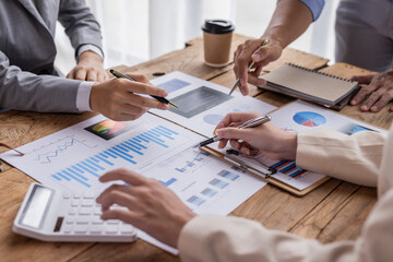 A team of Asian business advisers brainstorms a meeting to analyze and discuss the situation on the financial report in the workspace, Investment Consultant, Financial advisor accounting concept
