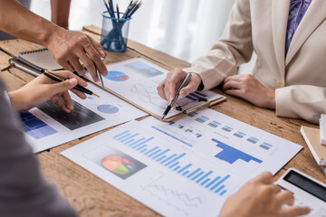 A team of Asian business advisers brainstorms a meeting to analyze and discuss the situation on the financial report in the workspace, Investment Consultant, Financial advisor accounting concept