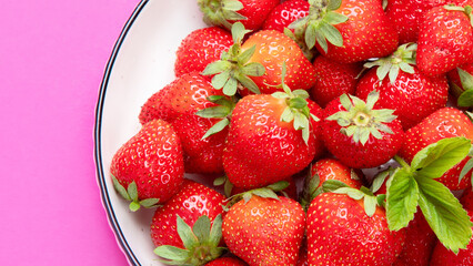 Strawberries on color background.