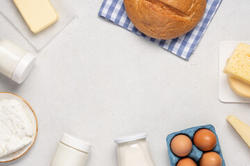 Variety of dairy products on white background. Bottle of milk, cheese, butter, yogurt or sour cream, cottage cheese. Farm dairy products concept