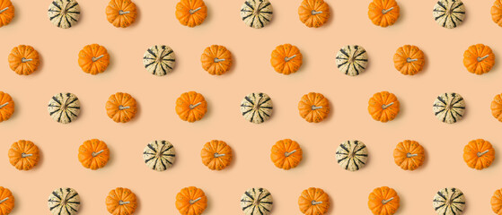 Many pumpkins on beige background. Pattern for design