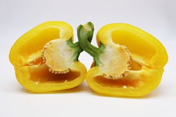 Fototapeta na wymiar sliced yellow bell pepper on white background