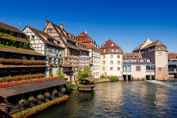 Fototapeta na wymiar Timber-framed houses at ill in La Petite France in Strasbourg in Alsace