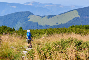 Unidentified Father carrying daughter on the Retezat Mountains, Romania