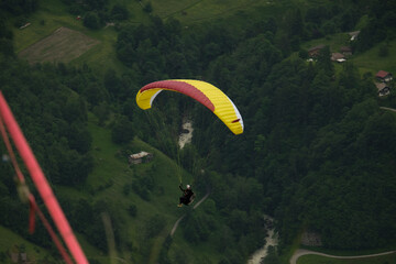 A picture with motion blur and noise effect of paragliding at Lauterbrunnen Valley