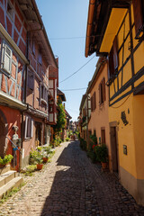 Fototapeta na wymiar street in the charming oldtown of Eguisheim in Alsace