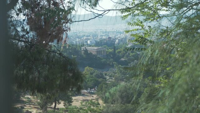 Temple of Aphrodite Urania seen through foliage. Extreme Wide Shot