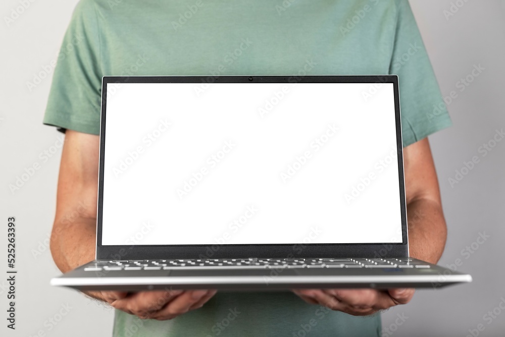 Poster Man holding laptop mockup with empty screen. Male using computer for showing presentation for work, study. Report, new project, startup presenting.