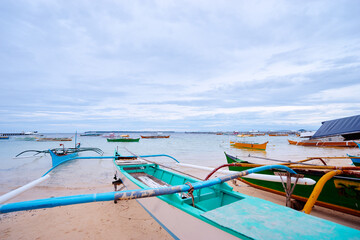 Fototapeta na wymiar Beach with traditional fishing boats, Philippines.