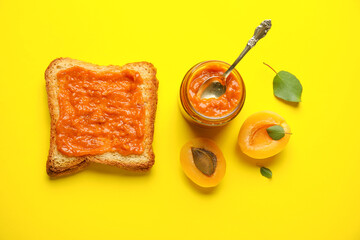 Toast with sweet apricot jam on yellow background