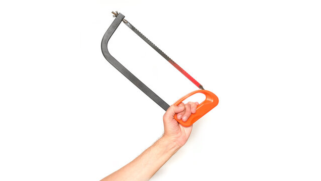 Male hand holding a hacksaw for metal on a white background