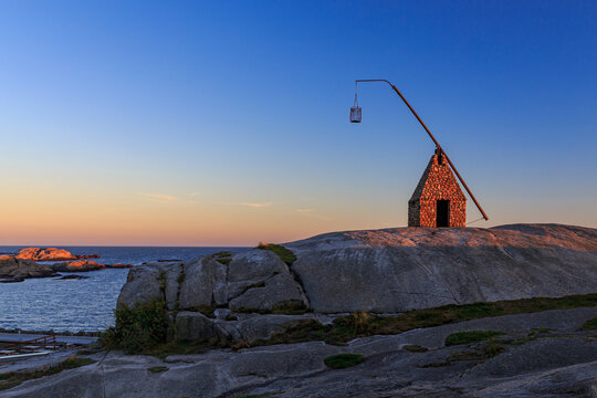 Sunset at the end of the world, Verdens Ende at the south coast of Norway with the ancient lighthouse Vippefyr