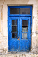 Fototapeta na wymiar Deserted Old Greek House with Old Blue Door in Chania,Crete, Greece