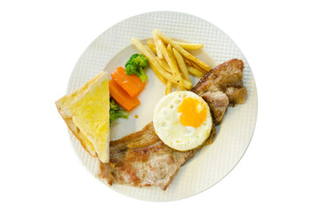 Top view of Pork Steak with french fries, fried eggs, toast on white plate, focus selective