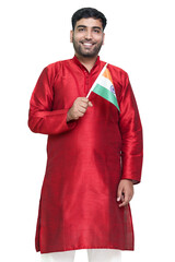 Indian boy in kurta holding indian national flag and showing patriotism, standing isolated background.