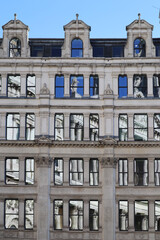 St. Paul's Churchyard and the reflection of the cathedral in the windows of surrounding buildings