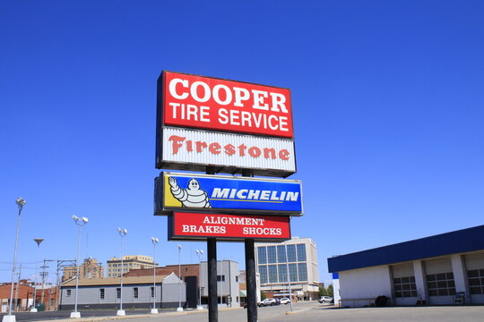 COOPER TIRE SERVICE sign with sky