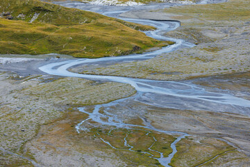 meandering alpine creek in Lämmerenboden in Valais