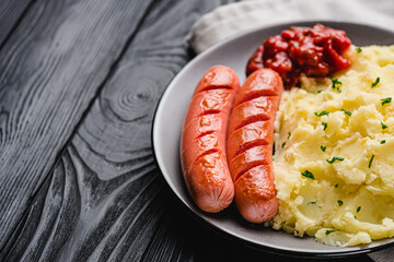 fresh tasty mashed potatoes on a black wooden rustic background