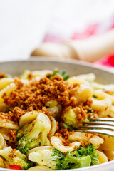 orequette pasta with broccoli on a white background