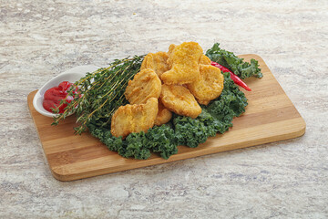 Crispy chicken nuggets with tomato ketchup