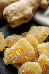 spicy dried ginger on a black wooden rustic background