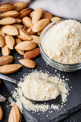almond flour on a black wooden rustic background