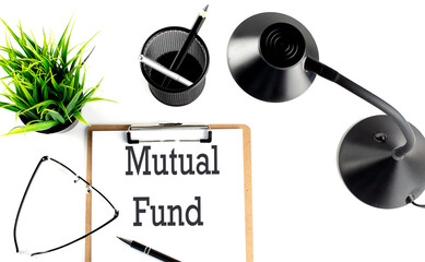 MUTUAL FUND text on a clipboard on the white background