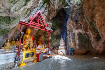 The gold Buddha statue in the cave at Wat Cha Am Khiri, Phetchaburi, Thailand
