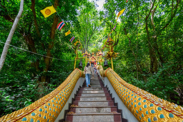 The stairs with a gold serpent statue at Wat Cha Am Khiri, Phetchaburi, Thailand