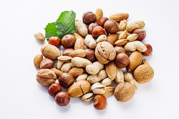 set of different nuts on a white acrylic background