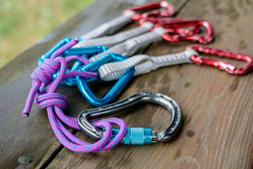 Climbing equipment on wooden background
