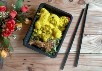 rice with chicken, flower and chopstic 