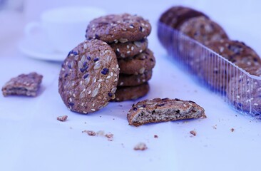 oatmeal cookies with cereals on the background of a cup of tea. The concept of healthy food, diet