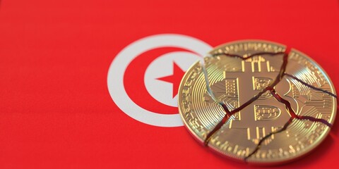 Flag of Tunisia and broken bitcoin. Cryptocurrency ban or crypto legal issues concepts, 3d rendering