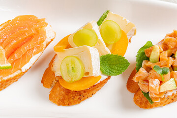 Christmas canape on the white plate